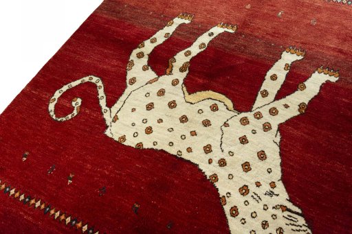 Backside of handmade 2000s Persian Gabbeh rug showing knot structure and weave density
