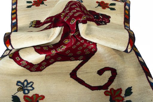Corner detail of 2000s Persian Gabbeh rug showing border pattern and Wool pile