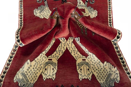 Corner detail of 2000s Persian Gabbeh rug showing border pattern and Wool pile