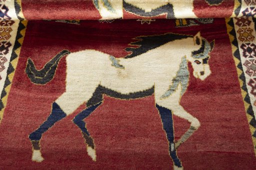 Full view of 2000s Persian Gabbeh rug from Iran / Persia, 185 × 120 cm in Red tones