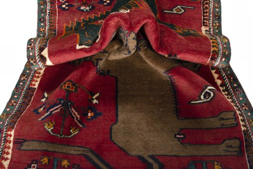 Corner detail of 2000s Persian Gabbeh rug showing border pattern and Wool pile