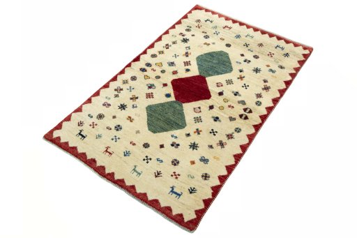 Corner detail of 2000s Persian Gabbeh rug showing border pattern and Wool pile