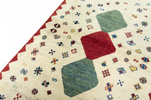 Backside of handmade 2000s Persian Gabbeh rug showing knot structure and weave density
