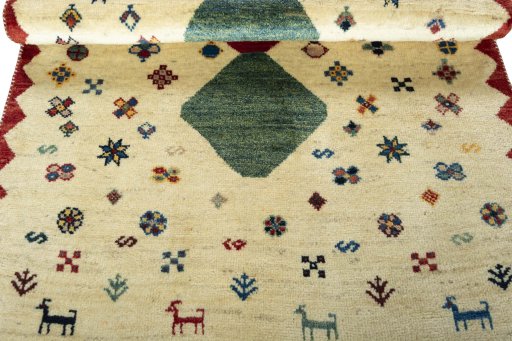 Full view of 2000s Persian Gabbeh rug from Iran / Persia, 167 × 101 cm in Beige tones