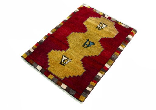 Corner detail of 2000s Persian Gabbeh rug showing border pattern and Wool pile