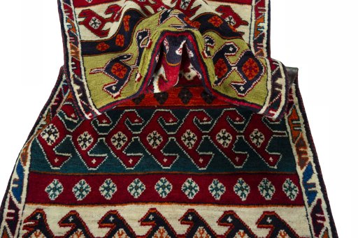 Corner detail of 2000s Persian Gabbeh rug showing border pattern and Wool pile
