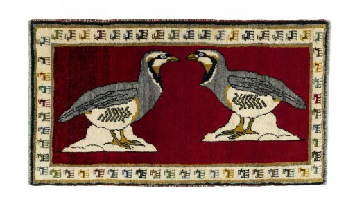 Full view of 2000s Persian Gabbeh rug from Iran / Persia, 110 × 64 cm in Red tones