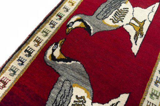 Backside of handmade 2000s Persian Gabbeh rug showing knot structure and weave density