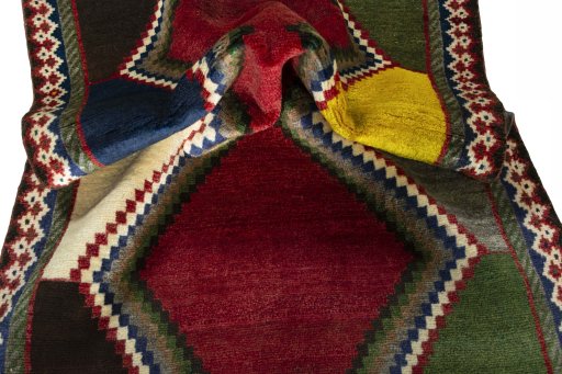 Corner detail of 2000s Persian Gabbeh rug showing border pattern and Wool pile