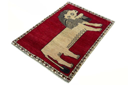 Corner detail of 2000s Persian Gabbeh rug showing border pattern and Wool pile