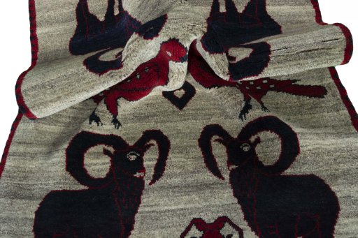 Corner detail of 2000s Persian Gabbeh rug showing border pattern and Wool pile