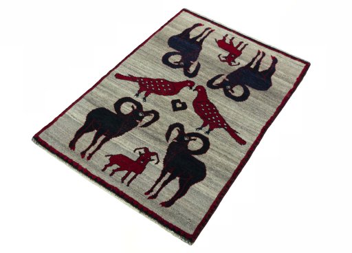 Corner detail of 2000s Persian Gabbeh rug showing border pattern and Wool pile
