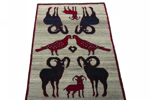 Surface texture of 2000s Persian Gabbeh rug with natural Wool and intricate pattern