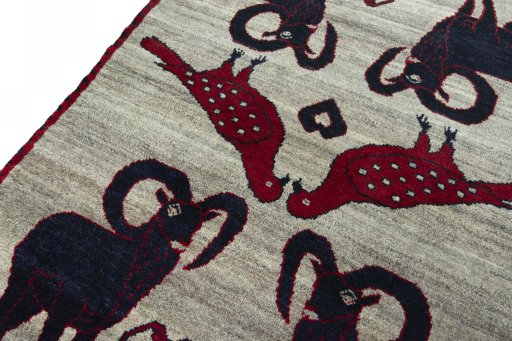Backside of handmade 2000s Persian Gabbeh rug showing knot structure and weave density