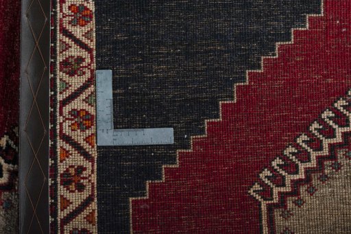 Surface texture of 2000s Persian Gabbeh rug with natural Wool and intricate pattern