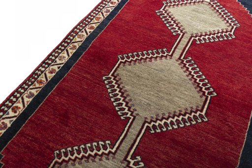 Backside of handmade 2000s Persian Gabbeh rug showing knot structure and weave density