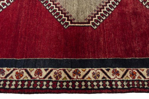 Full view of 2000s Persian Gabbeh rug from Iran / Persia, 195 × 105 cm in Red tones