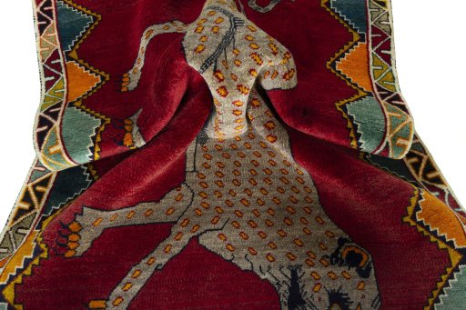 Corner detail of 2000s Persian Gabbeh rug showing border pattern and Wool pile