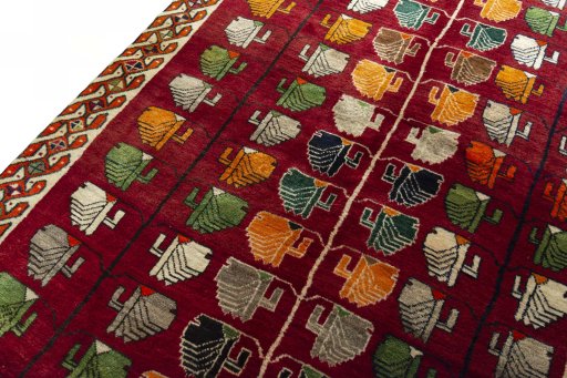 Backside of handmade 2000s Persian Gabbeh rug showing knot structure and weave density