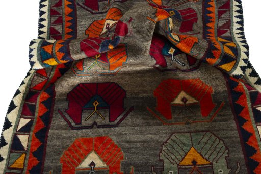 Corner detail of 2000s Persian Gabbeh rug showing border pattern and Wool pile