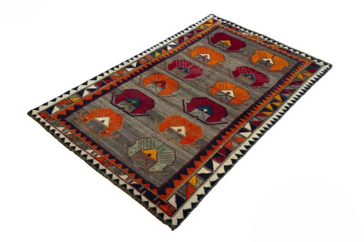 Corner detail of 2000s Persian Gabbeh rug showing border pattern and Wool pile