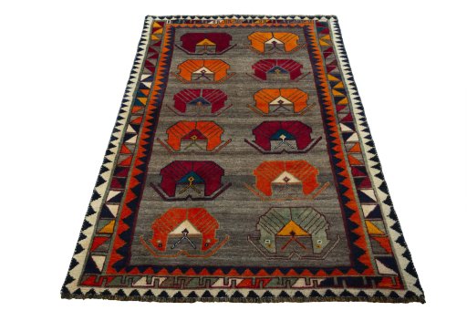 Surface texture of 2000s Persian Gabbeh rug with natural Wool and intricate pattern