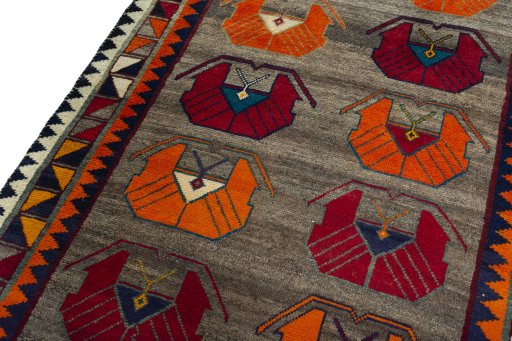 Backside of handmade 2000s Persian Gabbeh rug showing knot structure and weave density
