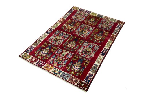 Corner detail of 2000s Persian Gabbeh rug showing border pattern and Wool pile