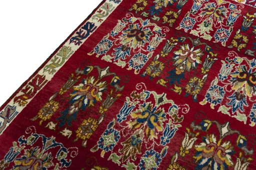 Backside of handmade 2000s Persian Gabbeh rug showing knot structure and weave density