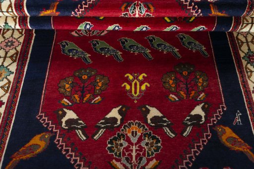 Corner detail of 2000s Persian Gabbeh rug showing border pattern and Wool pile