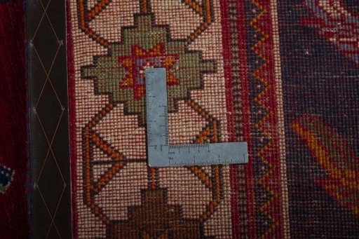 Surface texture of 2000s Persian Gabbeh rug with natural Wool and intricate pattern