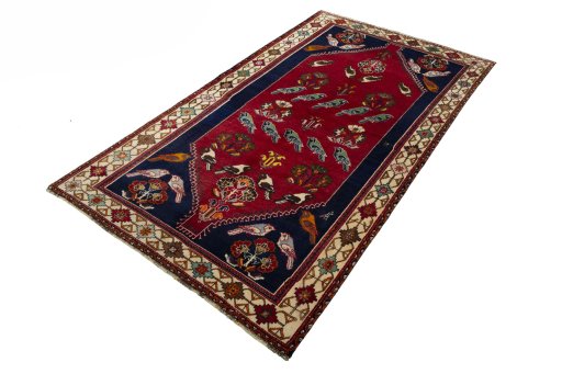 Corner detail of 2000s Persian Gabbeh rug showing border pattern and Wool pile