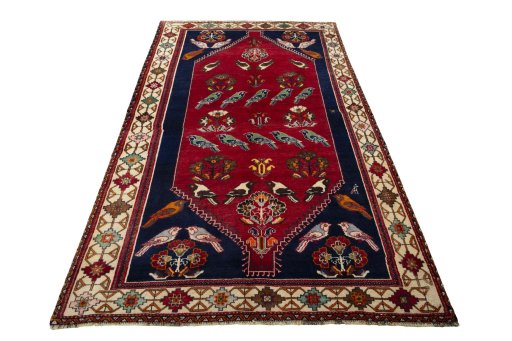 Surface texture of 2000s Persian Gabbeh rug with natural Wool and intricate pattern
