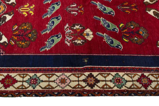 Full view of 2000s Persian Gabbeh rug from Iran / Persia, 288 × 163 cm in Red tones