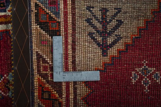 Surface texture of 2000s Persian Gabbeh rug with natural Wool and intricate pattern