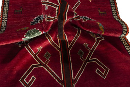 Corner detail of 2000s Persian Gabbeh rug showing border pattern and Wool pile