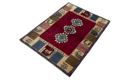 Corner detail of 2000s Persian Gabbeh rug showing border pattern and Wool pile