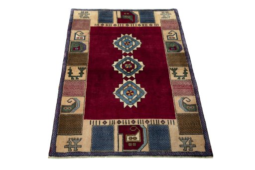 Surface texture of 2000s Persian Gabbeh rug with natural Wool and intricate pattern