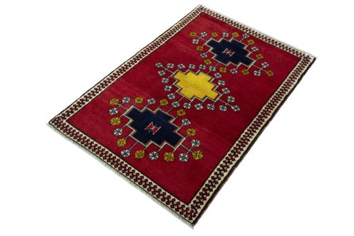 Corner detail of 2000s Persian Gabbeh rug showing border pattern and Wool pile