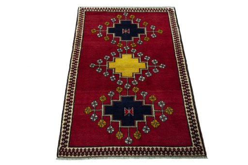 Surface texture of 2000s Persian Gabbeh rug with natural Wool and intricate pattern