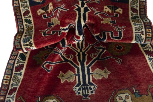 Corner detail of 2000s Persian Gabbeh rug showing border pattern and Wool pile