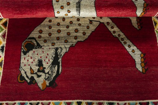 Full view of 2000s Persian Gabbeh rug from Iran / Persia, 178 × 108 cm in Red tones