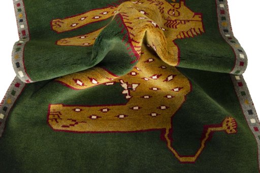 Corner detail of 2000s Persian Gabbeh rug showing border pattern and Wool pile