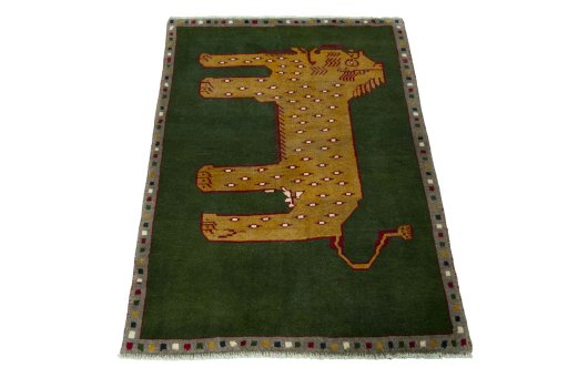 Surface texture of 2000s Persian Gabbeh rug with natural Wool and intricate pattern