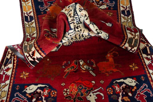 Corner detail of 2000s Persian Gabbeh rug showing border pattern and Wool pile