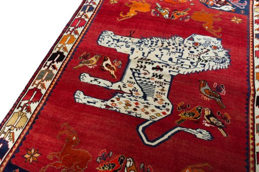Backside of handmade 2000s Persian Gabbeh rug showing knot structure and weave density