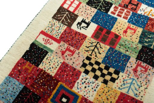 Backside of handmade New Persian Gabbeh rug showing knot structure and weave density