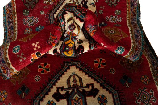 Corner detail of 2000s Persian Gabbeh rug showing border pattern and Wool pile
