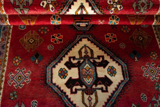 Full view of 2000s Persian Gabbeh rug from Iran / Persia, 202 × 122 cm in Red tones