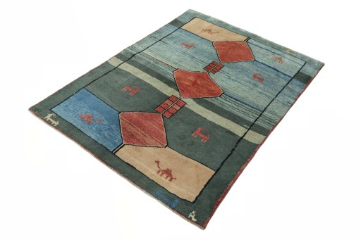 Corner detail of 2000s Persian Gabbeh rug showing border pattern and Wool pile
